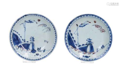 A pair of blue, white and underglaze red porcelain saucers, ...