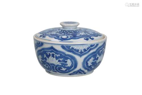 A blue and white lidded box, decorated with flowers. Unmarke...