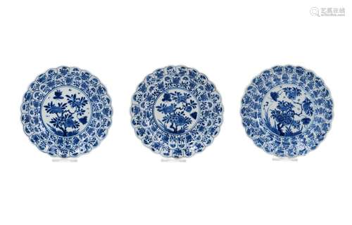 A set of three blue and white porcelain saucers with scallop...