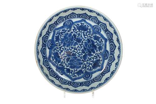 A blue and white porcelain deep charger, decorated with flow...