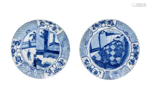 A pair of blue and white porcelain dishes with scalloped and...