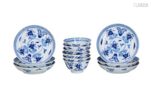 A set of six blue and white porcelain cups with saucers with...