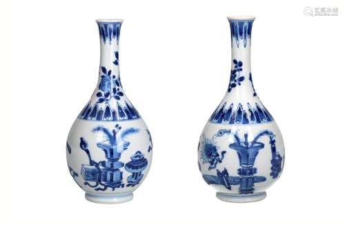 A pair of blue and white porcelain vases, decorated with ant...