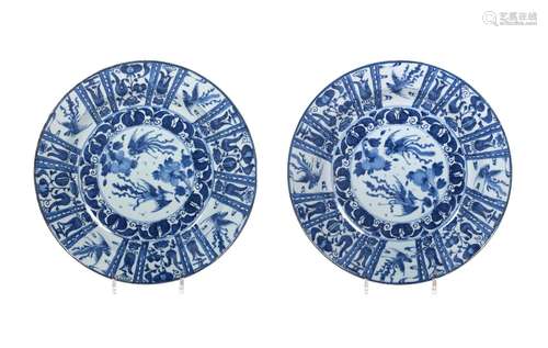 A pair of blue and white porcelain chargers, decorated with ...