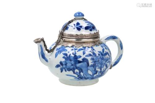 A blue and white porcelain teapot with silver mounting, deco...