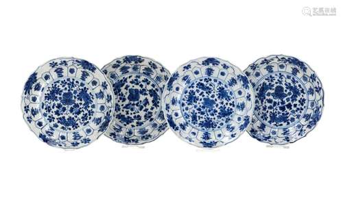 A set of four blue and white porcelain saucers, decorated wi...