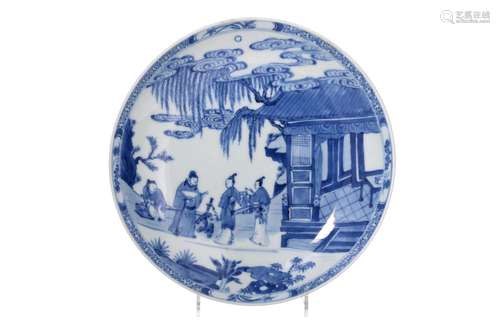 A blue and white porcelain dish, decorated with figures in a...