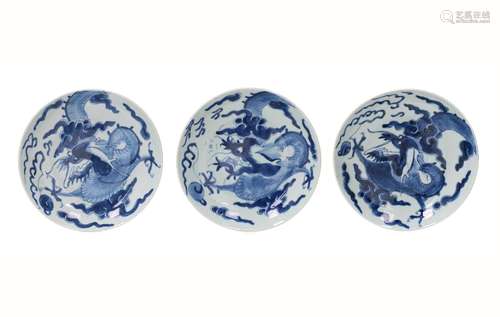 A set of three blue and white porcelain deep dishes, decorat...