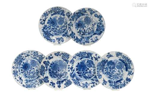 A set of six blue and white dishes with lobed rim, decorated...