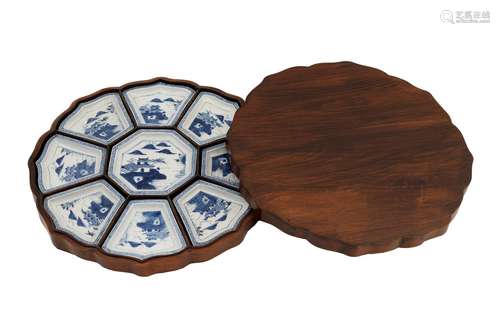 A blue and white porcelain sweetmeat dish in matching wooden...