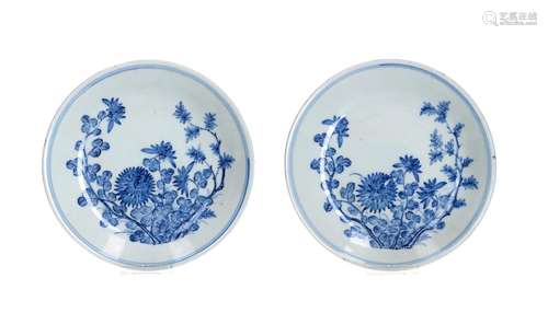 A pair of blue and white porcelain saucers, decorated with f...