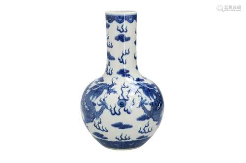 A blue and white porcelain vase, decorated with dragons chas...