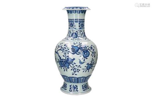 A blue and white porcelain vase, decorated with pomegranates...