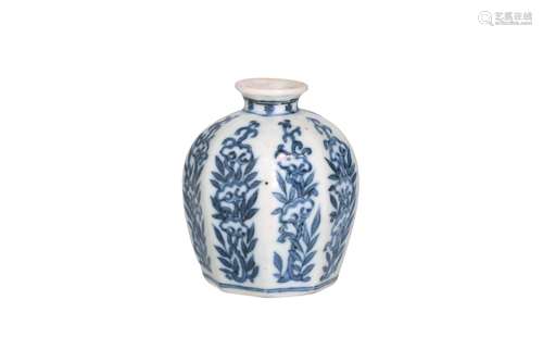 An octagonal blue and white porcelain miniature vase, decora...