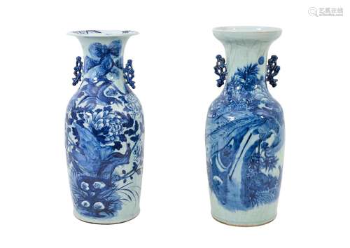 A pair of blue and white porcelain vases with ears, decorate...