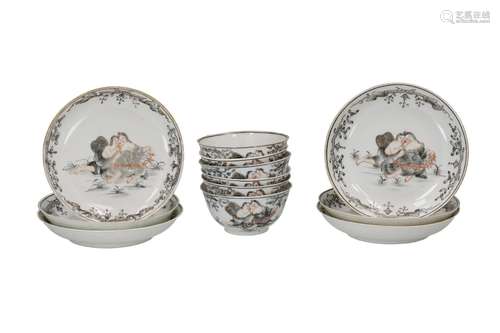 A set of six encre de Chine porcelain cups with saucers, dec...