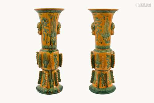 A pair of sancai glazed earthenware Gu vases, after an archa...