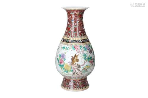 A polychrome porcelain vase, decorated with flowers and bird...