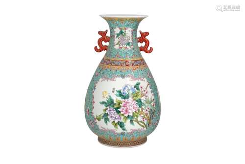 A polychrome porcelain vase with ears, decorated with flower...