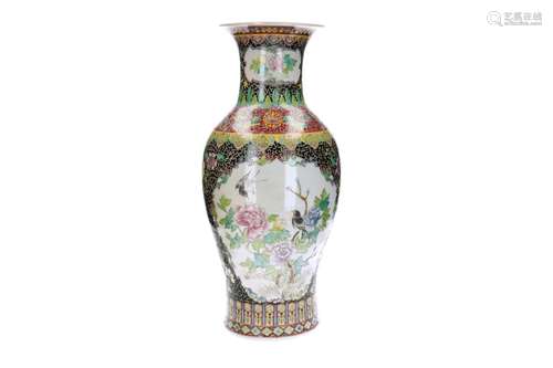 A polychrome porcelain vase, decorated with flowers and bird...