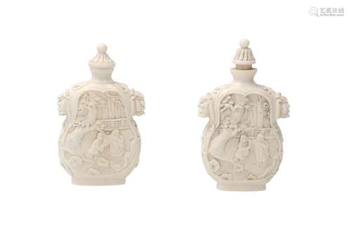 A pair of carved ivory snuff bottles, decorated with scenes ...