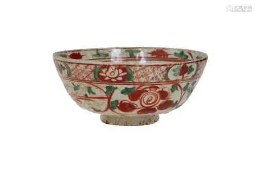 A polychrome Swatow porcelain bowl, decorated with flowers a...