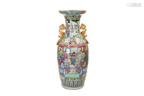 A polychrome porcelain vase with two gilded bronze handles, ...