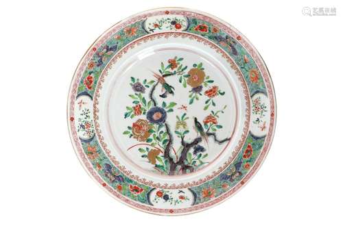 A famille verte porcelain charger, decorated with flowers an...