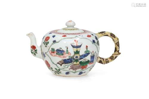 A famille verte porcelain teapot, decorated with flowers and...