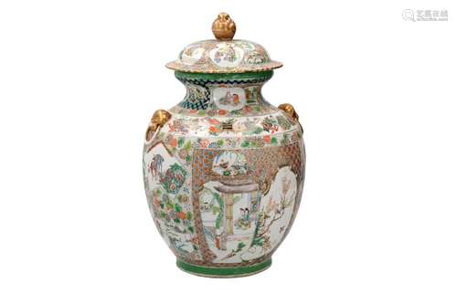 A famille verte porcelain lidded jar with two handles in the...