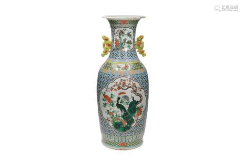 A polychrome porcelain vase, decorated with peacocks, birds ...