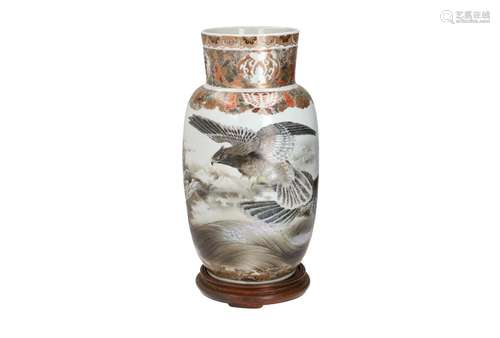 A Satsuma porcelain vase on wooden base, decorated with eagl...