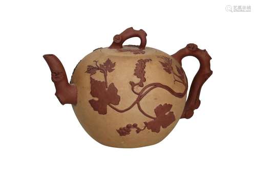 A Duanni Yixing teapot with brown relief decor of grape vine...