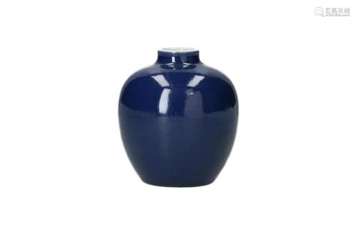 A blue porcelain vase on wooden stand. Marked with 6-charact...