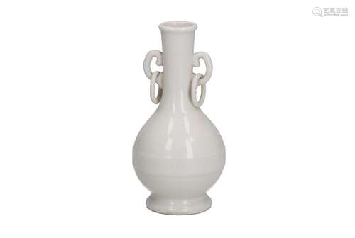 A blanc de Chine porcelain vase with two handles with loose ...