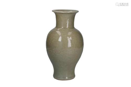 A celadon glazed porcelain vase, decorated with leaves and f...