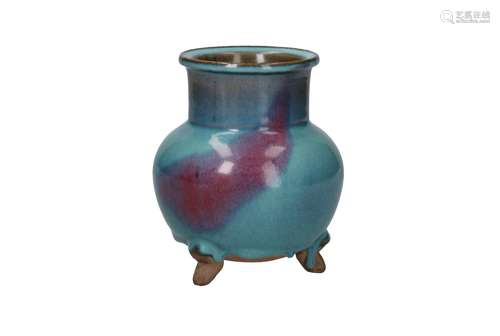 A blue glazed tripod Junyao stoneware vase. Unmarked. China,...