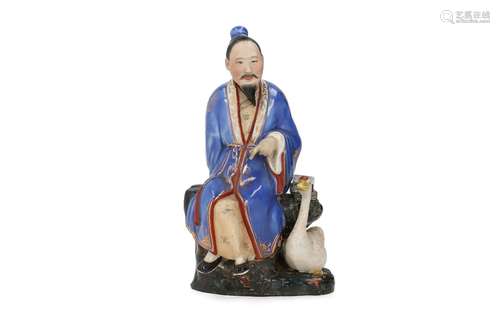 A polychrome porcelain sculpture depicting a man with a goos...