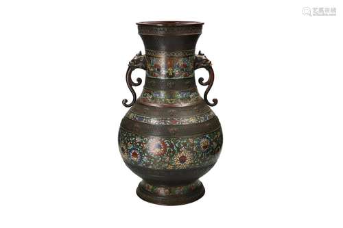 A bronze champleve vase with two handles in the shape of ele...