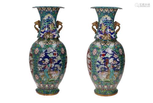 A pair of polychrome cloisonné vases, decorated with reserve...