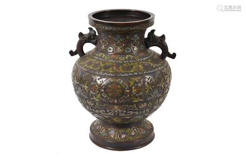 A bronze champleve vase with two handles in the shape of ele...