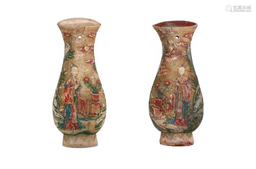 A pair of shoushan stone wall vases with polychrome relief d...