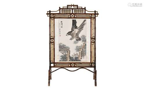 A bamboo room divider with scroll painting depicting an eagl...