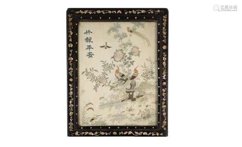 A silk embroidery in frame, depicting peacocks, birds, butte...