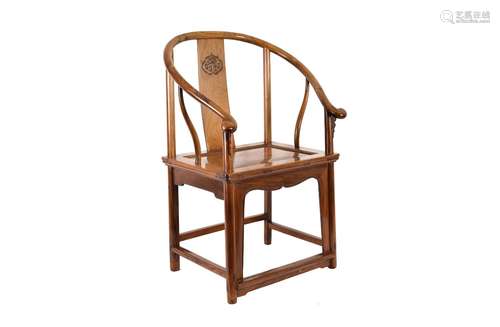 A Huanghuali wooden chair with horseshoe-shaped armrest. The...