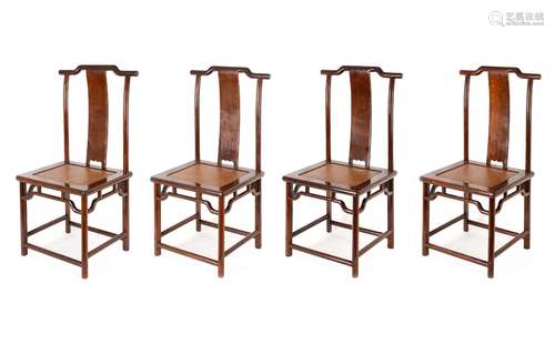 A set of four wooden chairs. China, 20th century. H. 104 cm....