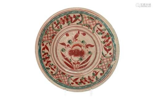 A Swatow style polychrome charger, decorated with flowers. U...