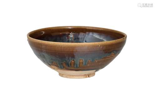 A black Cizhou ware bowl with russet splash decor. Unmarked....