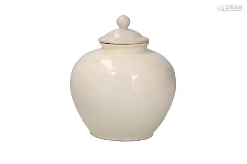 A globular white glazed lidded pot. Unmarked. China, Tang. H...