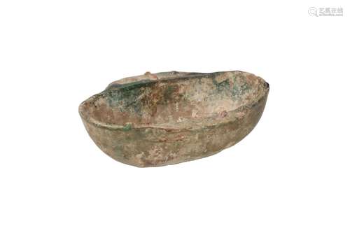 A green glazed earthenware ear cup, imitation of bronze. Unm...